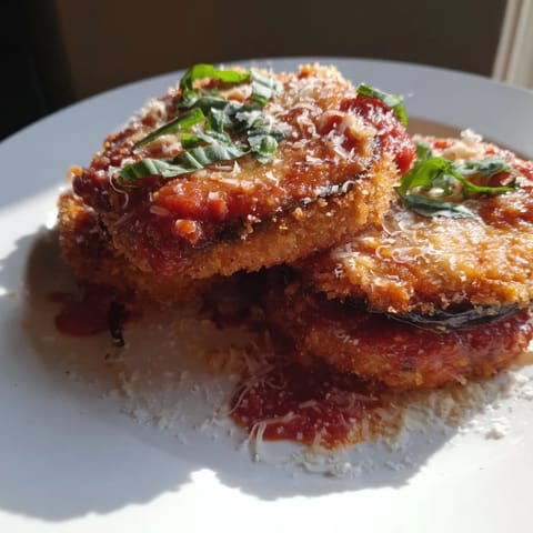 Golden, cheesy Eggplant Parmesan—a delicious Italian comfort food, baked until bubbly and irresistibly fragrant.
