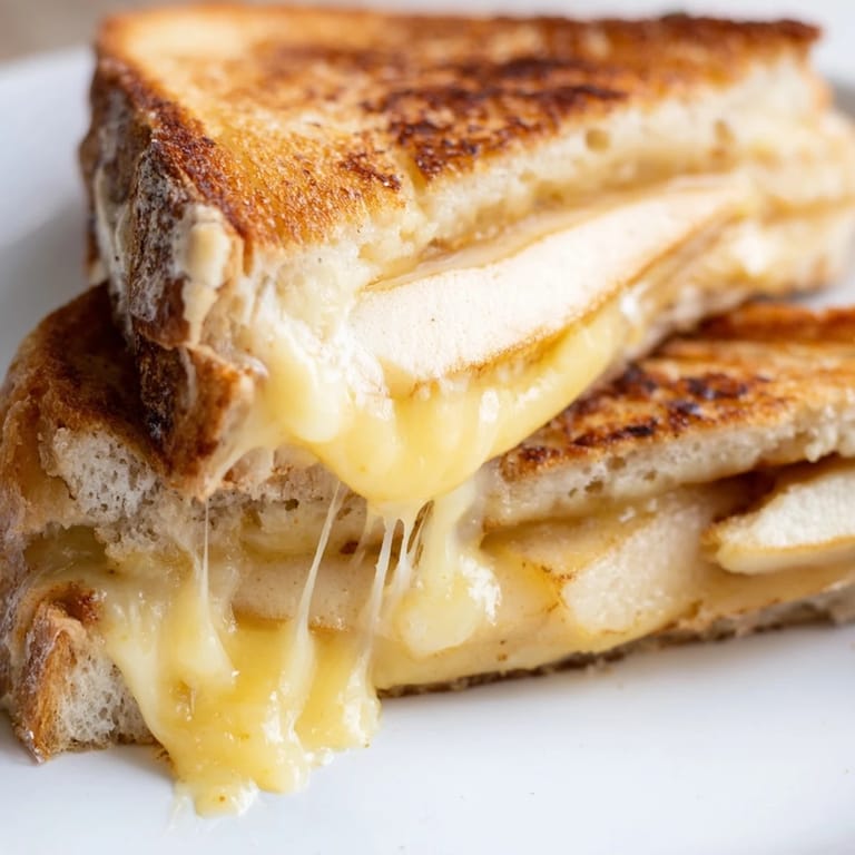 Melting smoked Gouda drips between buttery bread and thin apple slices in this easy Smoked Gouda & Apple Grilled Cheese.