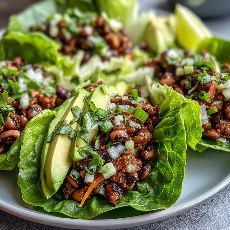 Freshly assembled Black-Eyed Pea Lettuce Wraps ready to serve, offering a vibrant, protein-packed appetizer or light meal.