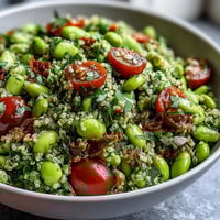 Colorful Edamame and Quinoa Salad, bursting with fresh vegetables and citrus dressing.