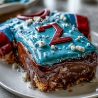 Graduation Sports Jersey Cake decorated with vibrant fondant colors and personalized jersey details, perfect for celebrating a boys graduation with a sporty twist.  