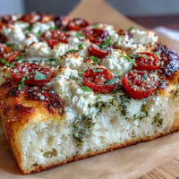 Viral Cottage Cheese Flatbread with pesto and juicy tomatoes, a high-protein delight.