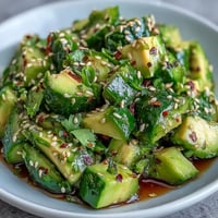 Smashed Cucumber and Avocado Salad: vibrant, crisp, creamy, with toasted sesame.